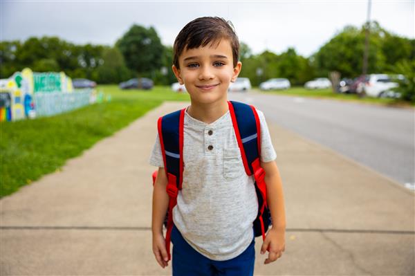 boy student wearing a backpack